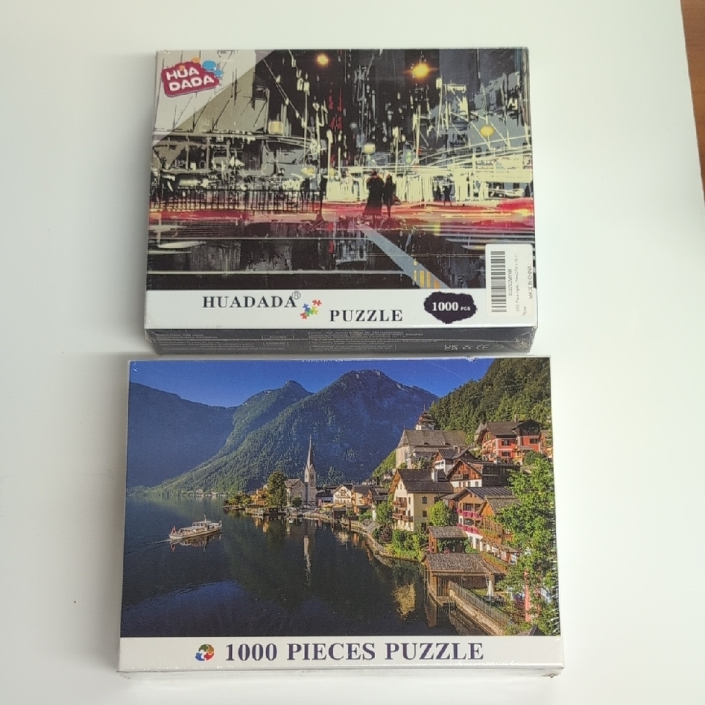 Two 1000 Piece Puzzles - Lake Side Town Scene and Urban Night City Scene